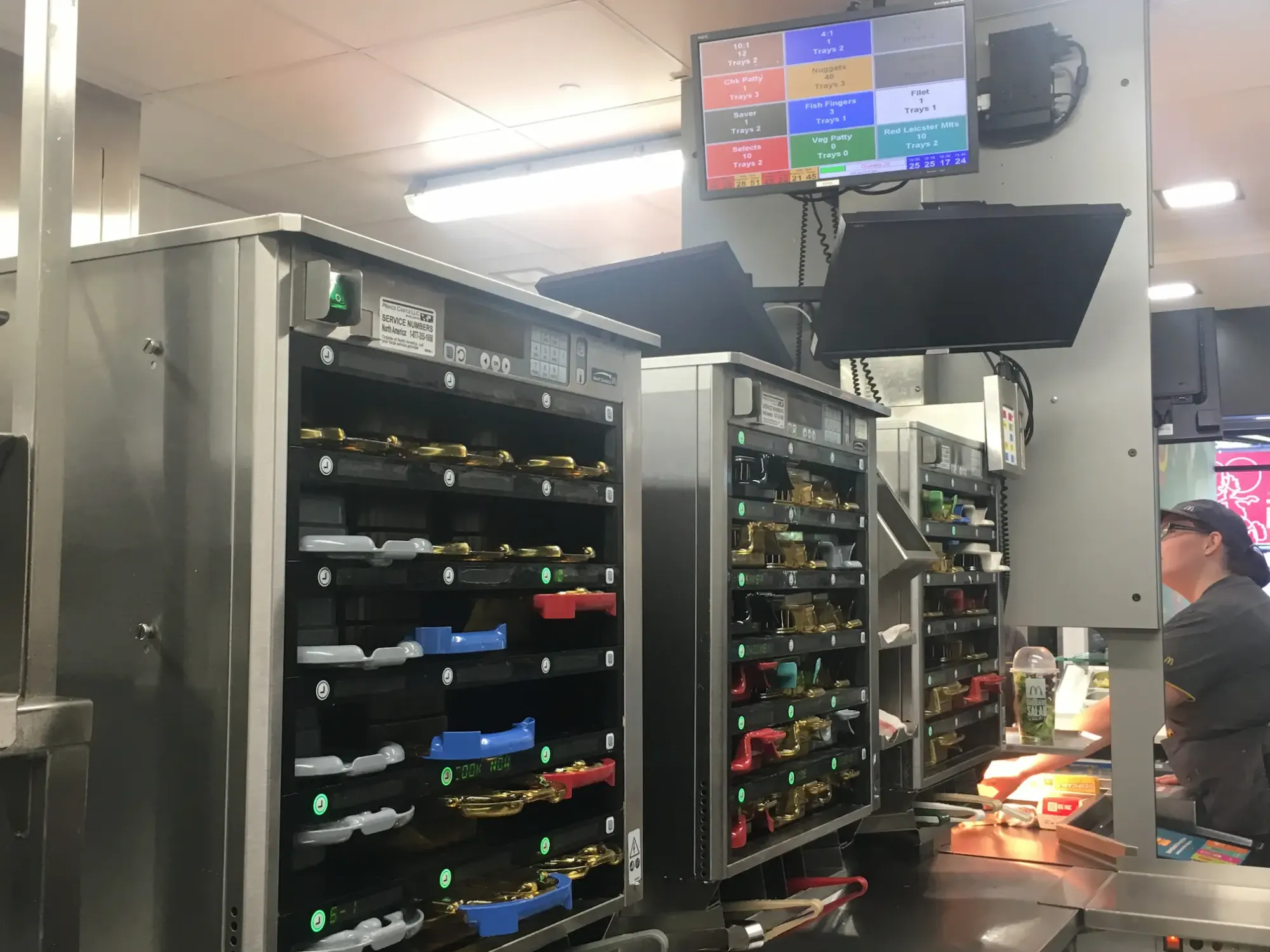 McDonald's employee glancing at the Kitchen Display System (KDS) while preparing a customer's order. This seemingly everyday scene unexpectedly sparked a creative leap, influencing the design direction for the Endoscopy Hub.